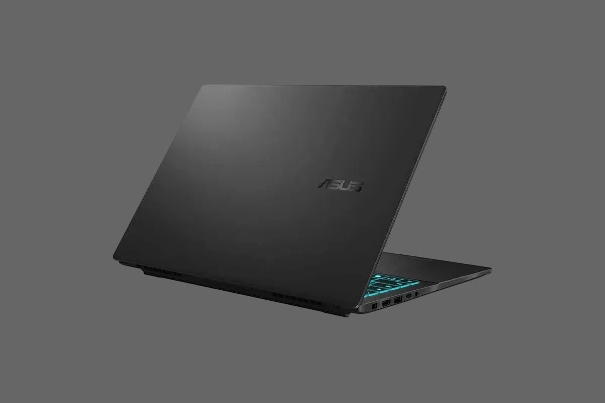 An ASUS gaming laptop shown open at an angle, featuring a matte black exterior, a silver ASUS logo on the lid, and a backlit keyboard with blue LED lighting, set against a plain white background.