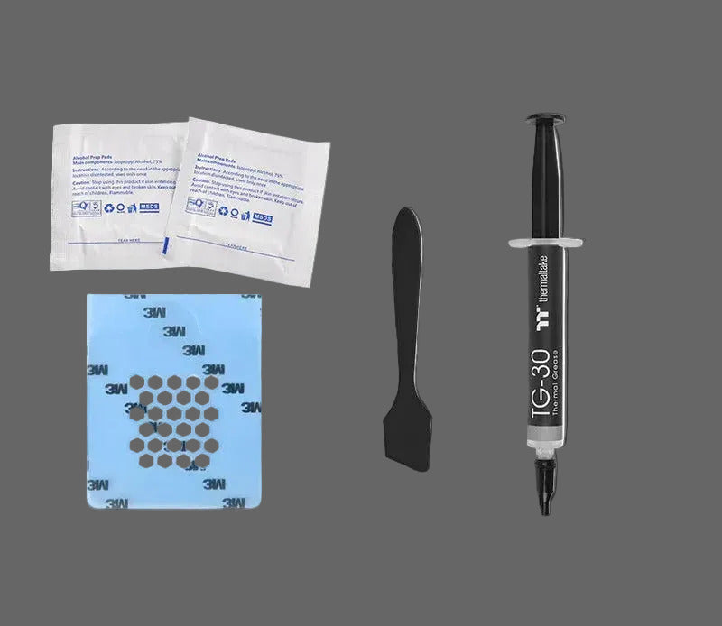 Set of dental materials including syringe, spatula, and adhesive strips on a white background