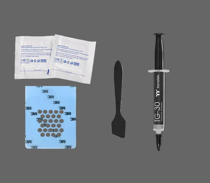 Set of dental materials including syringe, spatula, and adhesive strips on a white background